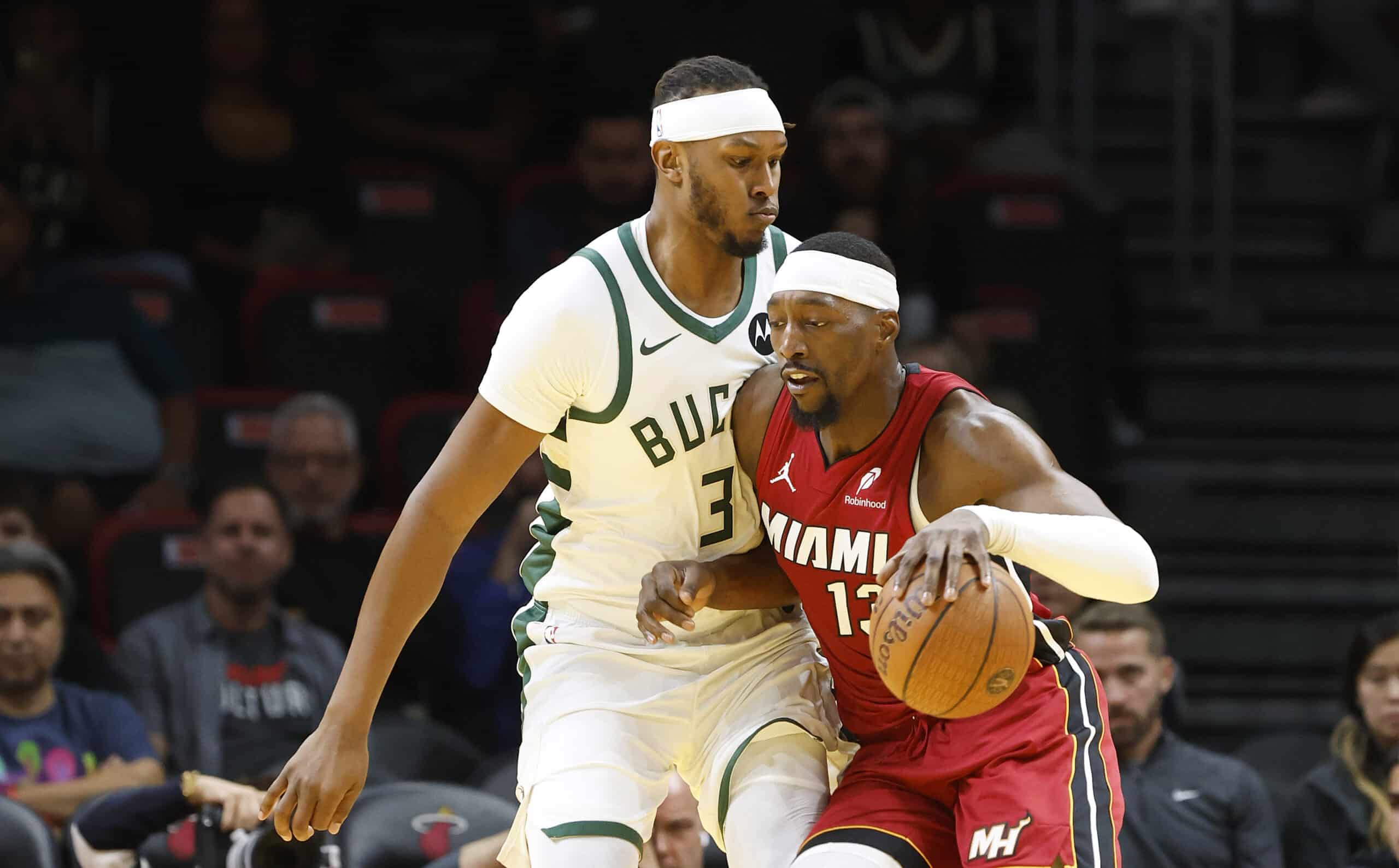 Nov 26, 2025; Miami, Florida, USA; Milwaukee Bucks center Myles Turner (3) defends Miami Heat center Bam Adebayo (13) during the first half of an NBA Cup game at Kaseya Center. Mandatory Credit: Rhona Wise-Imagn Images